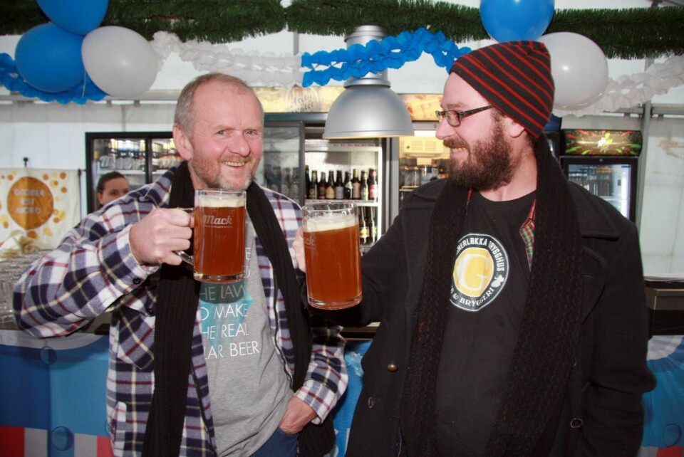Robert Johansen and Andreas Hegermann  Riis hoisted mugs of beer during the festival last weekend. Next year there will be local beer, they said.